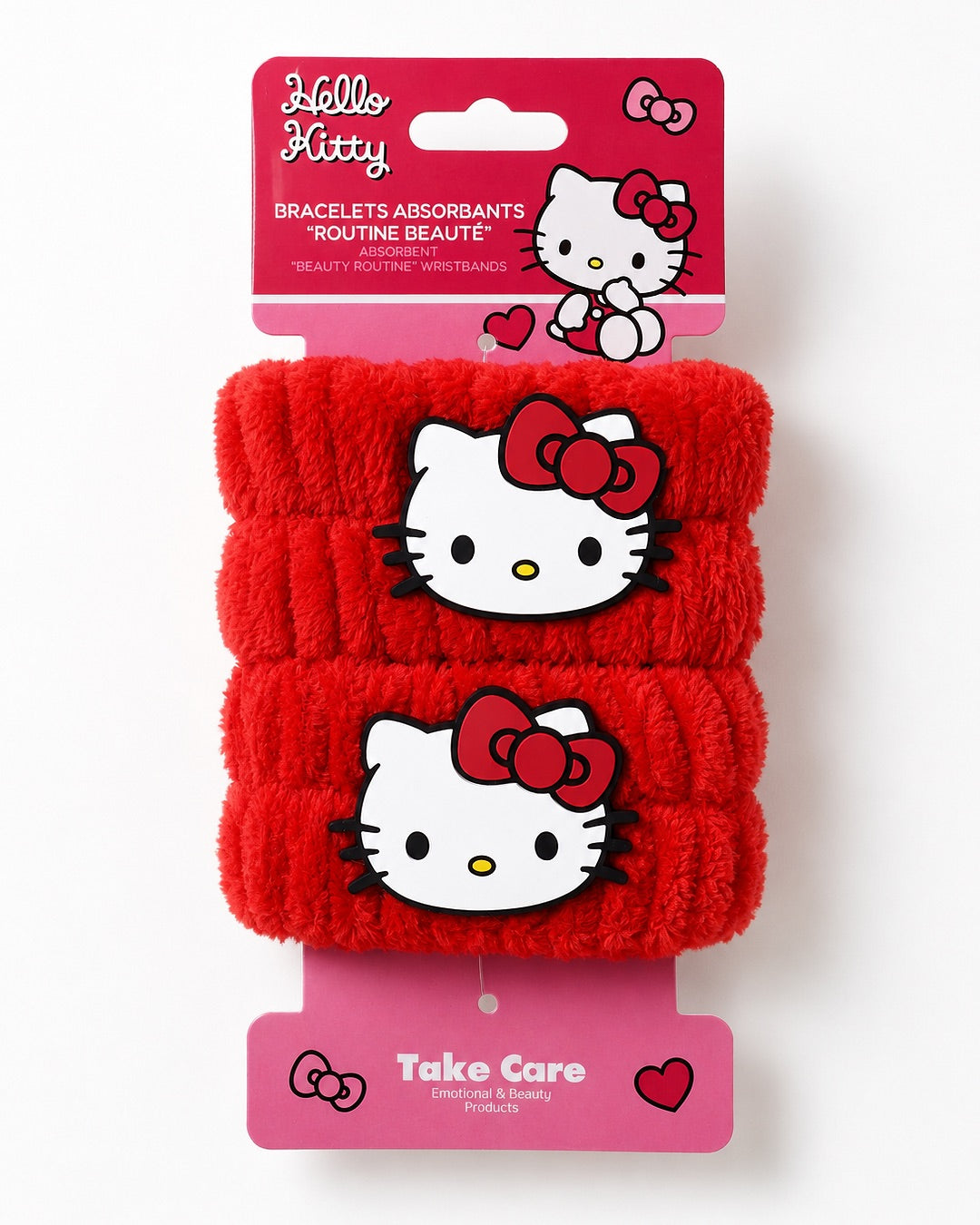 Paire de bracelets absorbants de lavage Hello Kitty rouge présentée sur sa carte d’emballage d’origine avec les logos Sanrio et Take Care Routine Beauté.