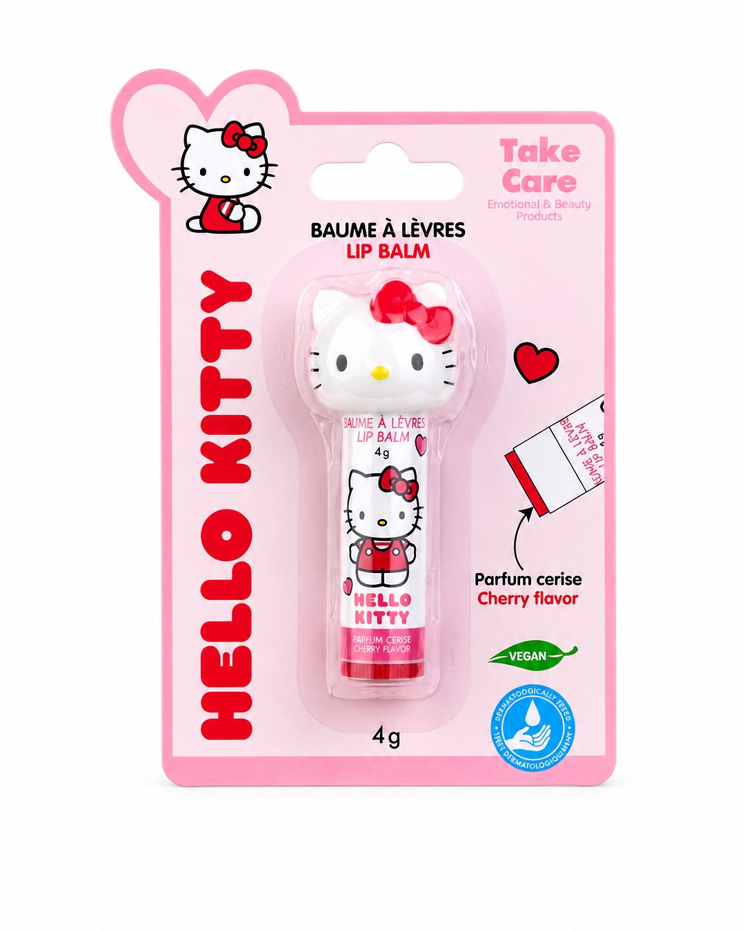 Baume à lèvres Hello Kitty à la cerise présenté de face sur sa carte d’emballage d’origine rose et blanche de la marque Take Care.
