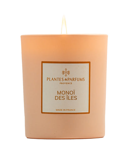 Bougie parfumée 180 g, fragrance Monoï des îles de Plantes & Parfums à la cire de soja dans un contenant en verre orange mat.