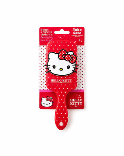 Brosse à cheveux démêlante Hello Kitty présentée sur sa carte d’emballage d’origine rouge et blanche avec mentions officielles Take Care.