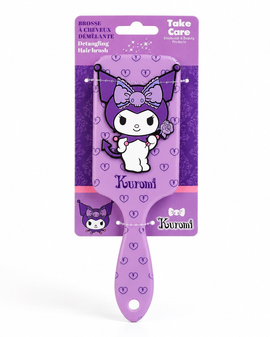 Brosse à cheveux plate démêlante Kuromi Sanrio présentée de face dans son emballage d'origine cartonné Take Care de couleur violet.