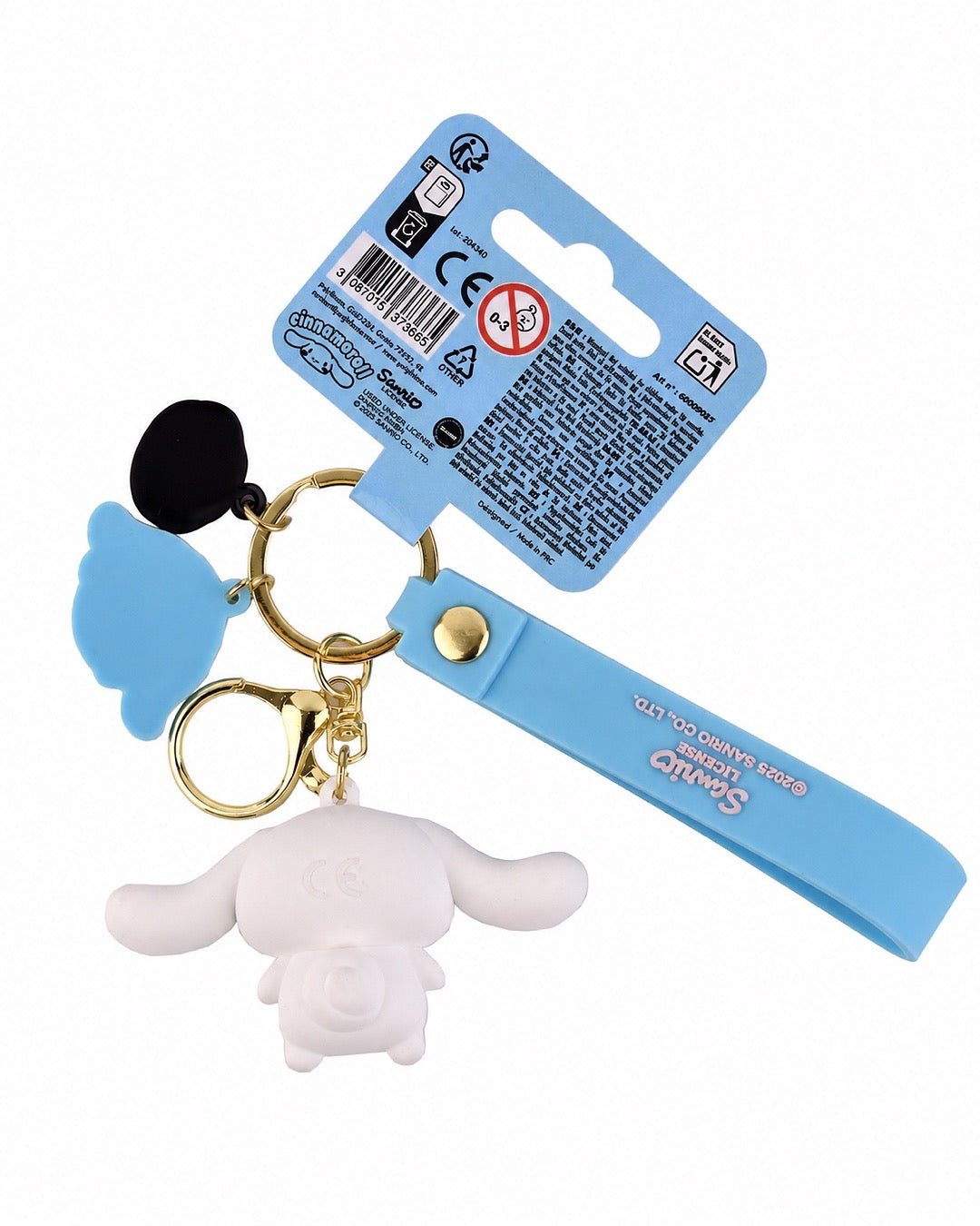 Porte-clés 3D Cinnamoroll avec lanière en silicone bleu, mousqueton doré, breloque de beigne rose et emballage cartonné bleu d'origine.