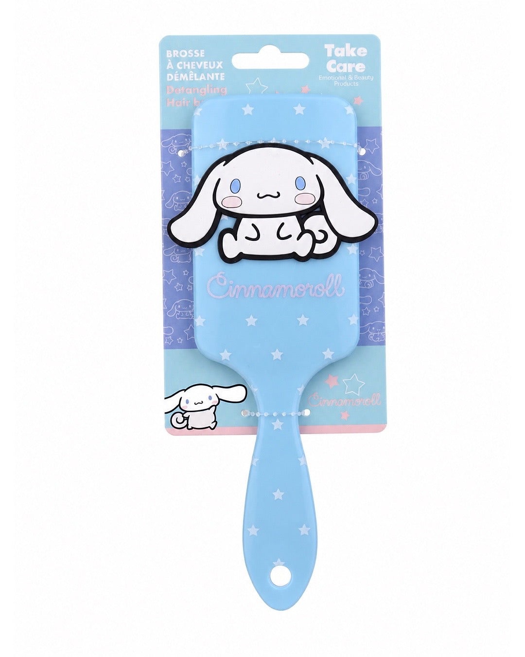 Brosse à cheveux rectangulaire bleu ciel avec des étoiles blanches et une grande figurine 3D en relief du personnage Cinnamoroll de Sanrio.