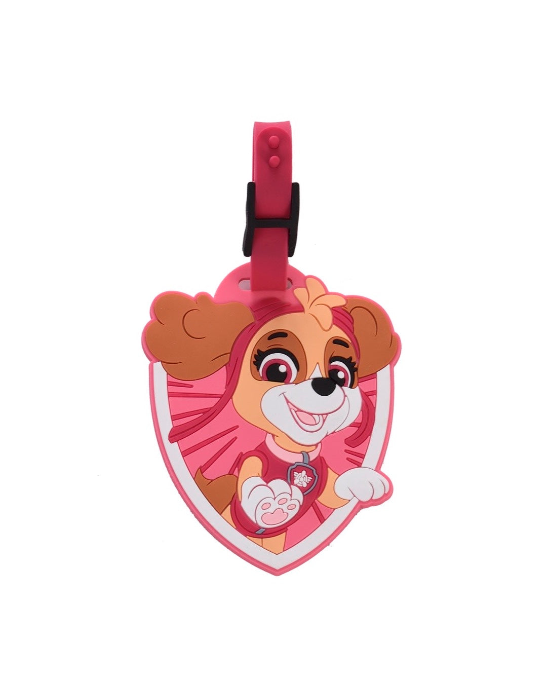 Étiquette à bagage officielle La Pat' Patrouille en silicone souple rose en forme de blason en relief, représentant le visage de Stella avec ses lunettes d'aviatrice. Une sangle ajustable rose avec un passant noir est fixée au sommet.