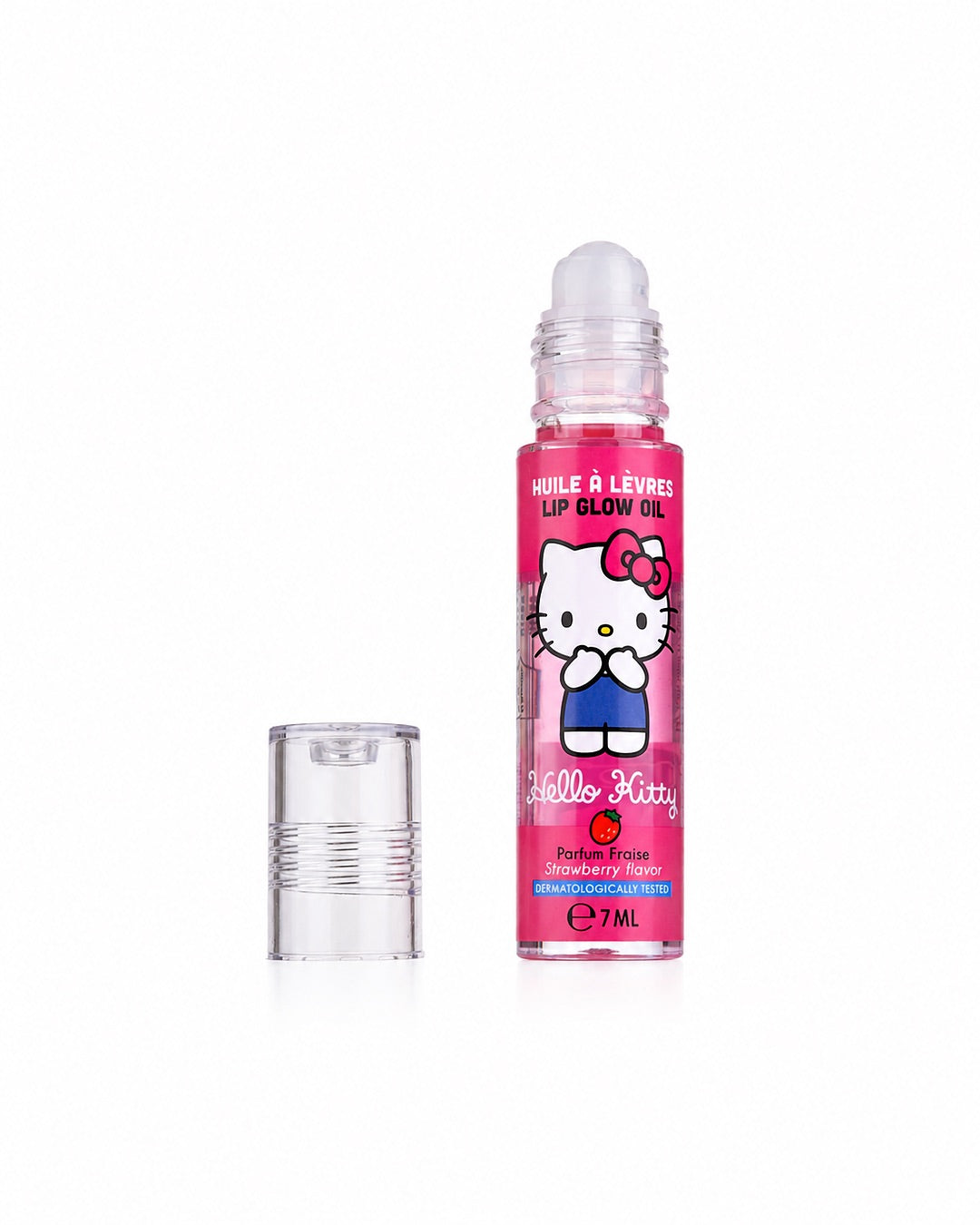 Flacon d’huile à lèvres Hello Kitty Lip Glow Oil à la fraise ouvert, montrant l’applicateur à bille avec son bouchon transparent posé à côté.