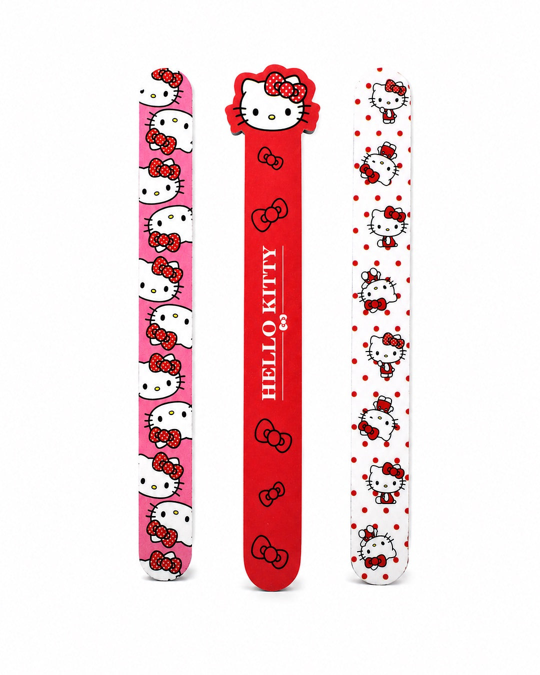 Vue de face d’un lot exclusif de 3 limes à ongles Hello Kitty de haute qualité aux motifs kawaii de couleur rose, rouge et blanche.