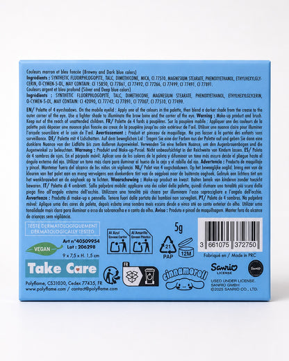 Une palette de fards à paupières Sanrio Cinnamoroll à 4 couleurs ouverte, comprenant des teintes mates et irisées de bleu, gris foncé, brun et argent, avec un applicateur double embout et un miroir intégré.