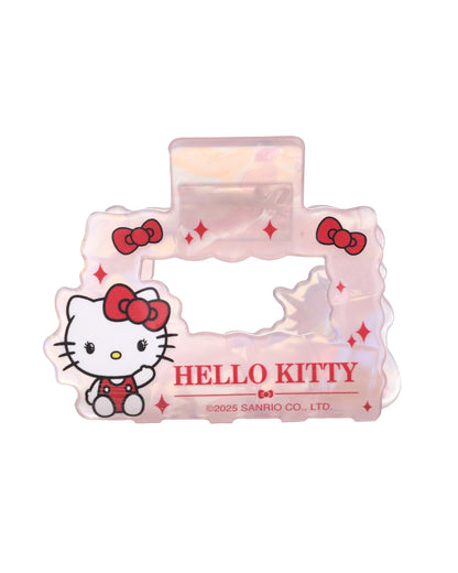 Vue de face d’une petite pince à cheveux rectangulaire Hello Kitty en acétate rose opale nacré, ornée de petits nœuds rouges.
