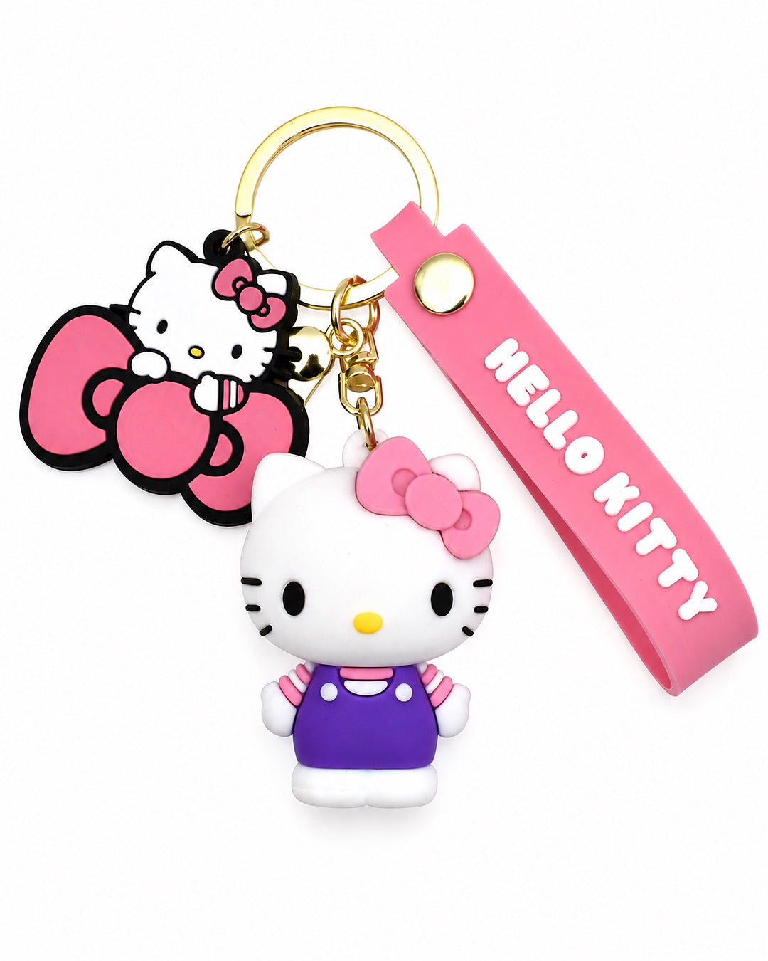 Vue de face d’un porte-clés premium Hello Kitty avec une figurine 3D en salopette violette, un grand charm en caoutchouc et une dragonne rose.