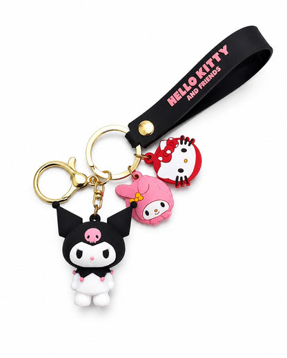 Vue de face d'un porte-clés figurine 3D Kuromi Sanrio avec des breloques et une sangle noire écrite Hello Kitty and Friends en lettres roses.