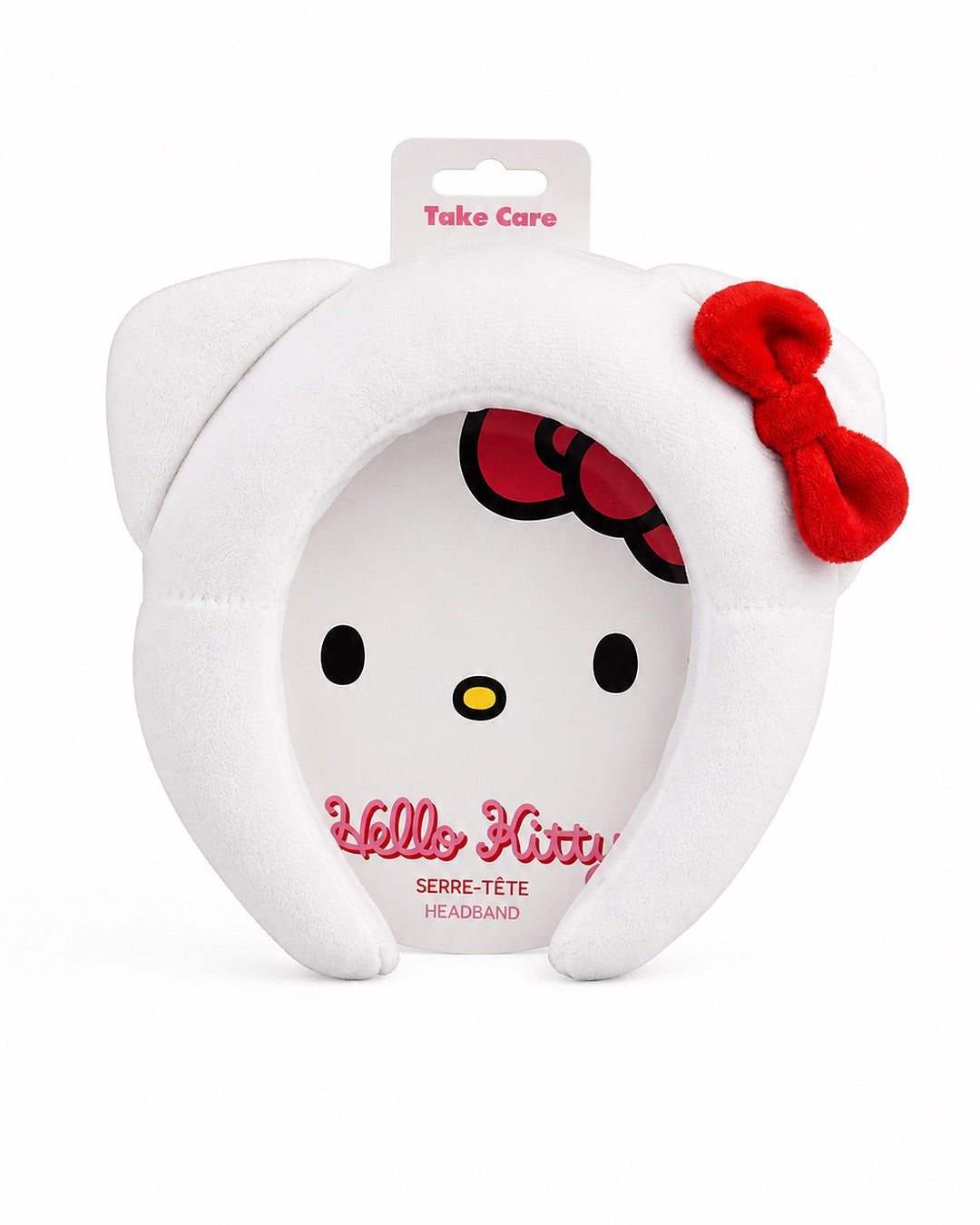 Vue de face du serre-tête de maquillage et soin en peluche blanche douce, doté des oreilles de chat emblématiques et du nœud rouge rembourré.