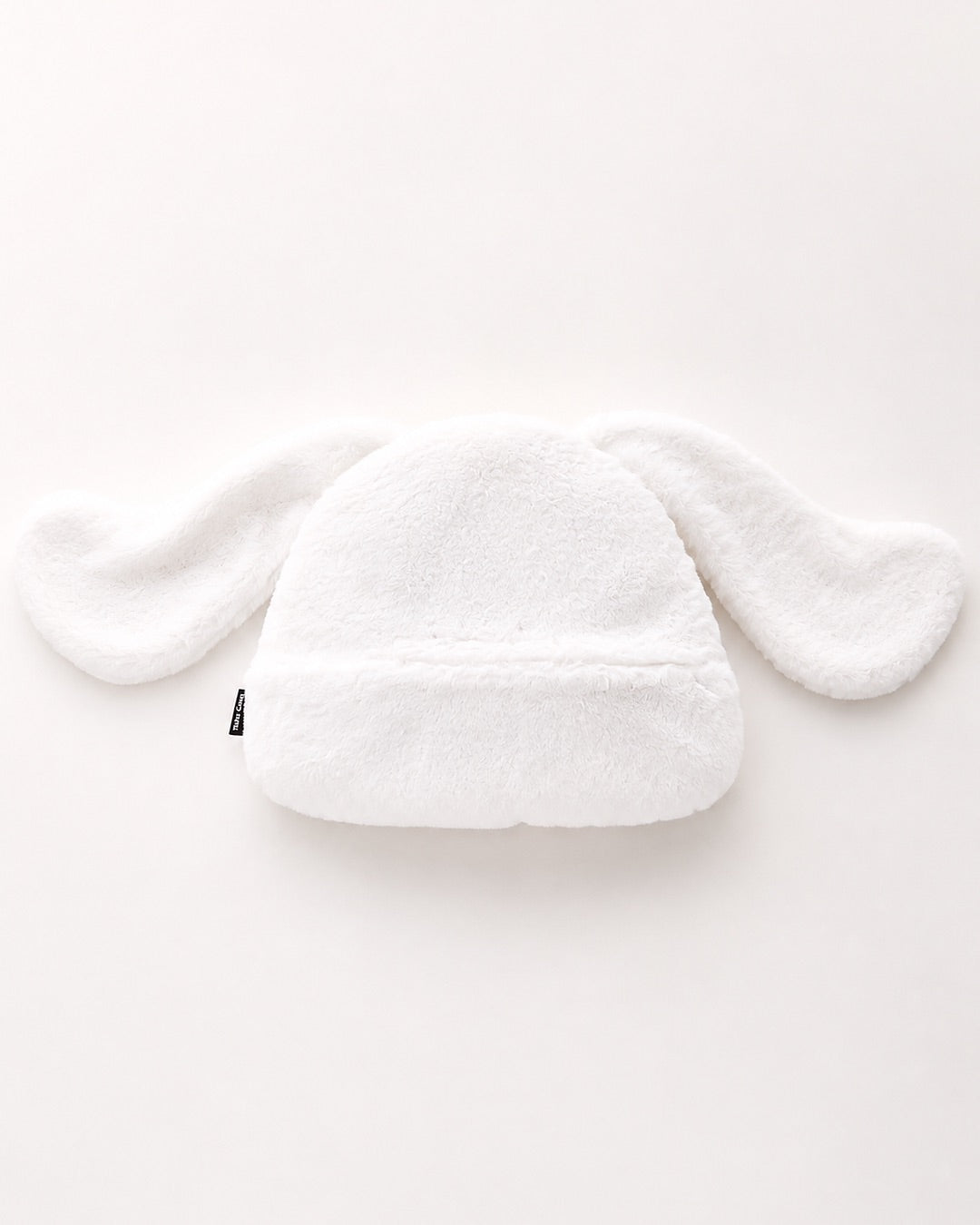 Bouillotte en peluche 3D Cinnamoroll Sanrio faisant office de housse et de range-pyjama blanc.